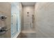 Walk-in shower with tile surround, bench seat, and dual shower heads at 2531 High Brow St # 41, Duluth, GA 30096
