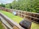 View of a fenced backyard with a small doghouse at 339 Garnet Dr, Acworth, GA 30101