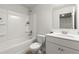 Bathroom featuring a tub-shower combo, white toilet and sink at 339 Garnet Dr, Acworth, GA 30101