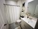 Well-lit bathroom with patterned tile flooring, a white vanity, and decorative accents at 339 Garnet Dr, Acworth, GA 30101