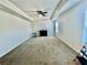 Bedroom featuring neutral carpet, tray ceiling, and a bright, airy atmosphere at 339 Garnet Dr, Acworth, GA 30101