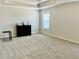 Spacious bedroom featuring neutral carpet, tray ceiling, and a bright, airy atmosphere at 339 Garnet Dr, Acworth, GA 30101