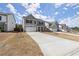 Beautiful two-story home boasting light gray siding and a spacious driveway at 339 Garnet Dr, Acworth, GA 30101