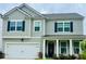 Two-story house with gray siding, black shutters, and a white front door at 339 Garnet Dr, Acworth, GA 30101