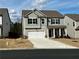 Charming two-story home with a well-manicured lawn and attached two-car garage at 339 Garnet Dr, Acworth, GA 30101