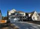 Charming two-story home with a two car garage and a well-manicured front yard on a sunny day at 339 Garnet Dr, Acworth, GA 30101