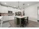 A modern kitchen with gray island and countertops, and stainless steel appliances at 339 Garnet Dr, Acworth, GA 30101