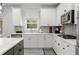 Modern kitchen with white cabinetry, stainless steel appliances, and stylish backsplash at 339 Garnet Dr, Acworth, GA 30101