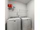 Bright laundry room with washer, dryer, and wire shelving at 339 Garnet Dr, Acworth, GA 30101