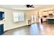 Open-concept living room with fireplace, hardwood floors, and kitchen view at 339 Garnet Dr, Acworth, GA 30101