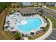 Aerial view of the community pool and deck area, featuring lounge chairs and a splash pad at 339 Garnet Dr, Acworth, GA 30101