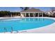 Community swimming pool with clubhouse, featuring a diving board and ample deck space at 339 Garnet Dr, Acworth, GA 30101