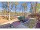 Landscaped backyard with stone pathway and wooded view at 3795 Greenside Ct, Dacula, GA 30019