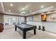 Finished basement recreation room with pool table and wet bar at 3795 Greenside Ct, Dacula, GA 30019