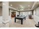 Finished basement recreation room with pool table and wet bar at 3795 Greenside Ct, Dacula, GA 30019