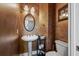 Powder room with pedestal sink and decorative walls at 3795 Greenside Ct, Dacula, GA 30019