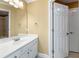 Simple bathroom with a single sink vanity and access to another room at 3795 Greenside Ct, Dacula, GA 30019