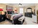 Charming bedroom with a queen-size bed and stylish dark furniture at 3795 Greenside Ct, Dacula, GA 30019