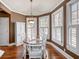 Bright dining room with hardwood floors and whitewashed furniture at 3795 Greenside Ct, Dacula, GA 30019