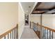 Bright and spacious hallway with tray ceiling and elegant railing at 3795 Greenside Ct, Dacula, GA 30019