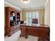 Home office features built-in shelving and large desk at 3795 Greenside Ct, Dacula, GA 30019