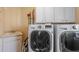 Convenient laundry room with washer, dryer, and utility sink at 3795 Greenside Ct, Dacula, GA 30019