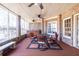 Screened porch with hot tub and outdoor seating area at 3795 Greenside Ct, Dacula, GA 30019