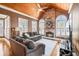 Sunroom with vaulted ceiling, stone fireplace, and hardwood floors at 3795 Greenside Ct, Dacula, GA 30019