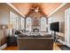 Sunroom with vaulted ceiling, stone fireplace, and hardwood floors at 3795 Greenside Ct, Dacula, GA 30019