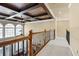 Upper hallway with wood railing and carpeted flooring at 3795 Greenside Ct, Dacula, GA 30019