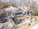 An aerial view of a charming craftsman-style home with a welcoming front porch and a lovely front yard with a fountain at 536 Moreland Ne Ave, Atlanta, GA 30307