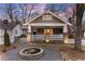 Charming home with a welcoming front porch, stone accents, and a water fountain at 536 Moreland Ne Ave, Atlanta, GA 30307