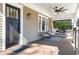 Inviting front porch with a ceiling fan, comfortable seating, and stylish decor at 536 Moreland Ne Ave, Atlanta, GA 30307