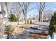 Landscaped front yard with a water fountain, fresh greenery, and a charming white picket fence at 536 Moreland Ne Ave, Atlanta, GA 30307