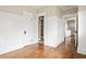 Charming hallway featuring hardwood flooring and white wainscotting at 536 Moreland Ne Ave, Atlanta, GA 30307