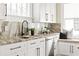 Modern kitchen with a stainless steel dishwasher, sleek countertops, and a window seat at 536 Moreland Ne Ave, Atlanta, GA 30307