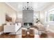 Elegant living room with a modern fireplace, stylish furniture, and hardwood floors at 536 Moreland Ne Ave, Atlanta, GA 30307