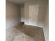 Bedroom featuring carpet floors, light walls and multiple doors at 7540 Knoll Hollow Rd, Lithonia, GA 30058