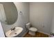 This powder room has a pedestal sink and a toilet with a white elongated bowl at 7540 Knoll Hollow Rd, Lithonia, GA 30058