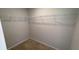 Empty walk-in closet featuring carpet floors and wire shelving at 7540 Knoll Hollow Rd, Lithonia, GA 30058