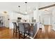 Modern kitchen with white cabinets, granite counters & island at 4045 High Gables E, Cumming, GA 30041