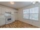 Bright kitchen featuring modern white cabinets, appliances, and hardwood flooring for an inviting space at 2813 Melanie Ln, Douglasville, GA 30135