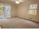 Bedroom with a ceiling fan, neutral walls, and access to a deck at 3720 Riviera Dr, Cumming, GA 30041