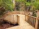 A multi-level wood deck overlooking wooded area provides a great outdoor space at 3720 Riviera Dr, Cumming, GA 30041