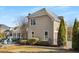 Tan house exterior with a three-car garage and manicured lawn at 916 Saint Lyonn Cts, Marietta, GA 30068