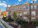 Three-story brick townhouse, landscaping at 104 Laurel Crest Aly, Johns Creek, GA 30024