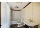 Bathroom featuring a tub-shower, toilet, and sink at 1381 Allgood Rd, Marietta, GA 30062