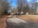 Exterior view of home with driveway and three cars parked outside at 1381 Allgood Rd, Marietta, GA 30062