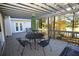 Inviting back porch with outdoor seating, a pergola, and views of a tranquil lake and lush greenery at 3711 Club Nw Dr, Kennesaw, GA 30144