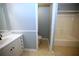 Bathroom featuring a vanity, sink, and a shower-tub combo with white tile surround at 3711 Club Nw Dr, Kennesaw, GA 30144